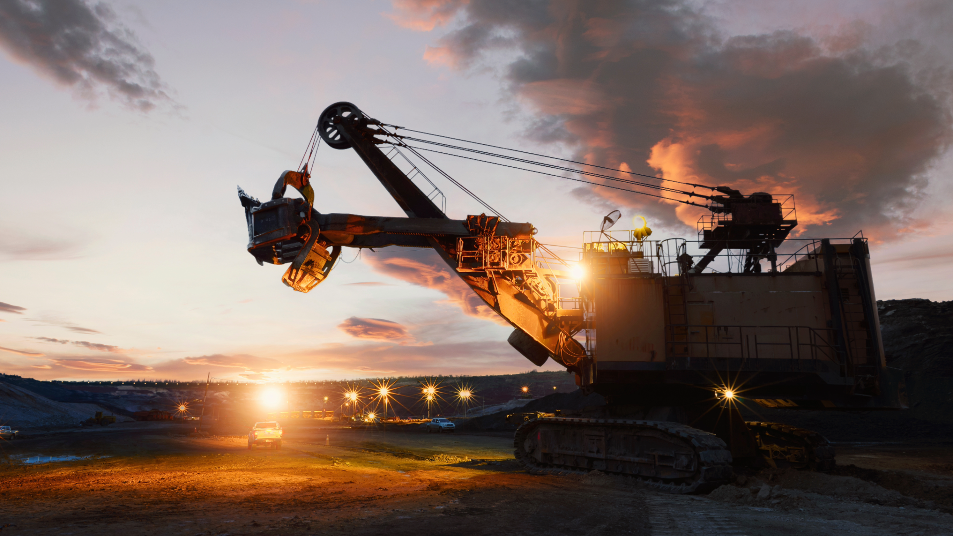 Mining equipment operating during sunset — representing TLG Minerals’ global supply of Soda Ash, Barite, Boron, Chromium Ore, Feldspar, and Zeolite.