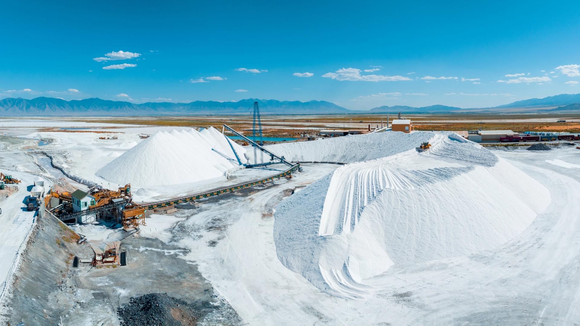 Soda ash (sodium carbonate) stockpiles with conveyor system at TLG Minerals processing site